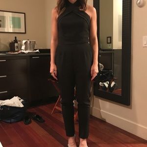 Black jumpsuit with around the neck clasp